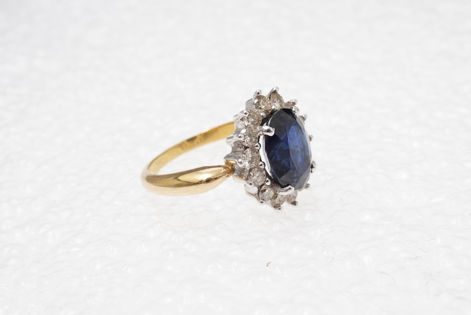 A sapphire and diamond cluster ring